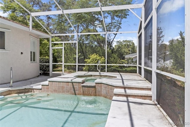 3563 W Blossom Dr, Beverly Hills, FL 34465 - outdoor pool featuring an in-ground hot tub, glass enclosure, and a patio area
