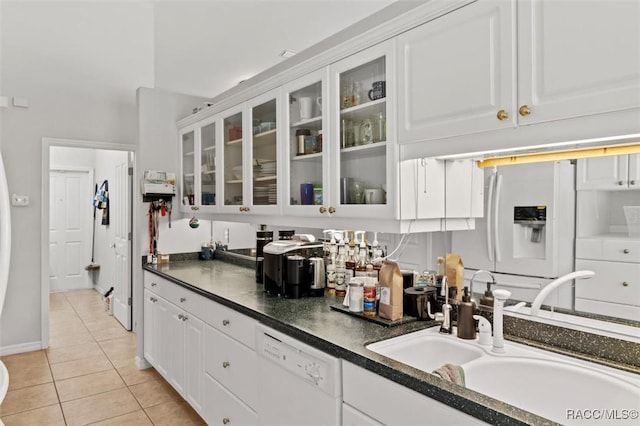 3563 W Blossom Dr, Beverly Hills, FL 34465 - kitchen featuring white appliances, a sink, light tile patterned flooring, white cabinetry, and dark countertops