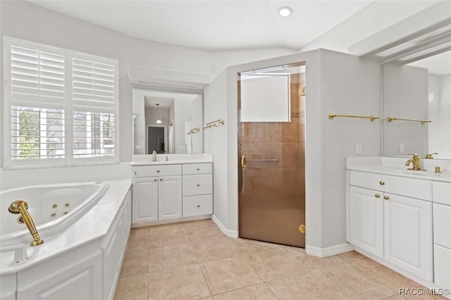 3563 W Blossom Dr, Beverly Hills, FL 34465 - full bathroom with a stall shower, tile patterned floors, a tub with jets, two vanities, and baseboards