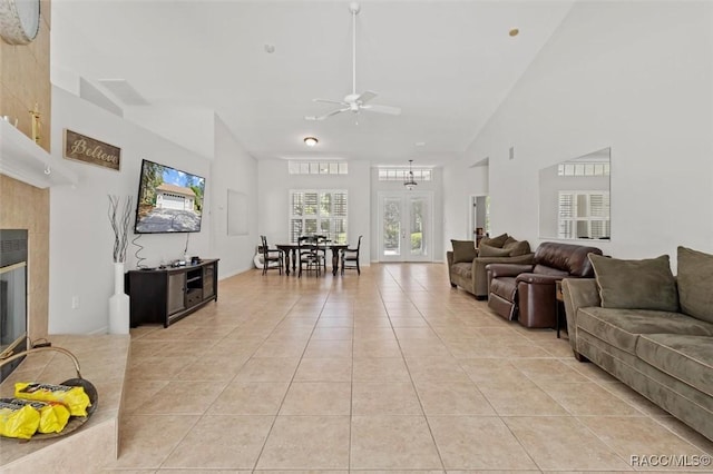 3563 W Blossom Dr, Beverly Hills, FL 34465 - living area with ceiling fan, light tile patterned floors, a fireplace, and high vaulted ceiling