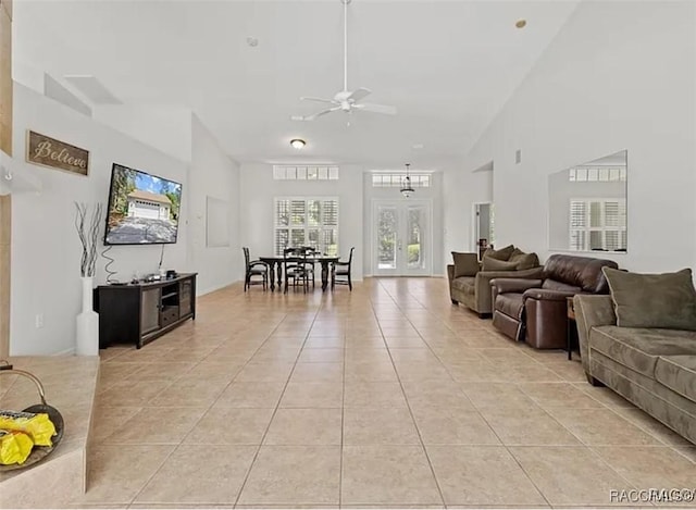3563 W Blossom Dr, Beverly Hills, FL 34465 - living area featuring light tile patterned floors, ceiling fan, and vaulted ceiling