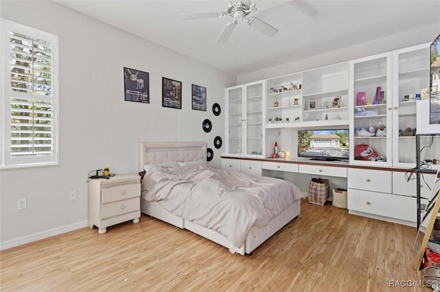 3563 W Blossom Dr, Beverly Hills, FL 34465 - bedroom featuring light wood finished floors, baseboards, and ceiling fan