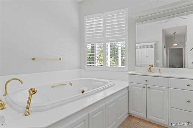 3563 W Blossom Dr, Beverly Hills, FL 34465 - bathroom with a tub with jets, vanity, and tile patterned flooring