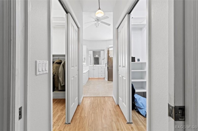 3563 W Blossom Dr, Beverly Hills, FL 34465 - hallway featuring light wood-style flooring and baseboards