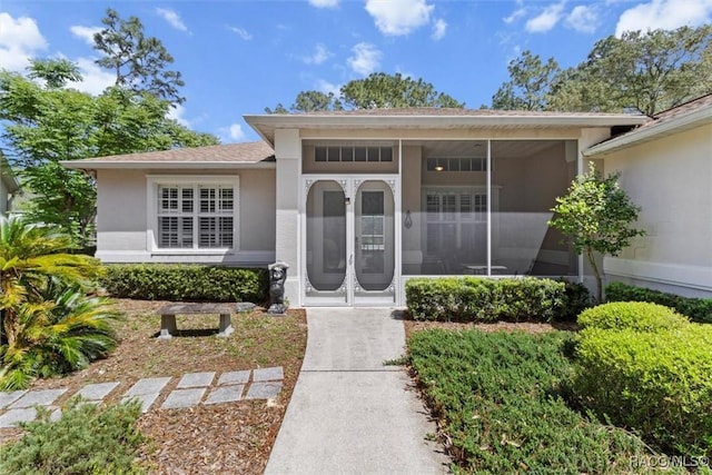 3563 W Blossom Dr, Beverly Hills, FL 34465 - view of exterior entry featuring stucco siding