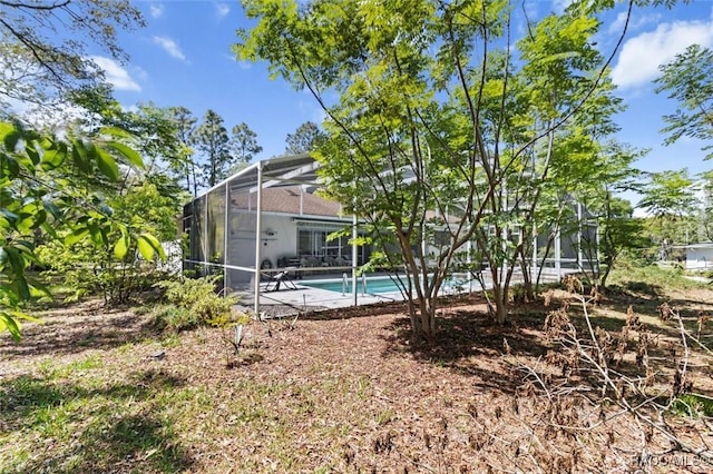 3563 W Blossom Dr, Beverly Hills, FL 34465 - back of property featuring an outdoor pool, a lanai, and a patio