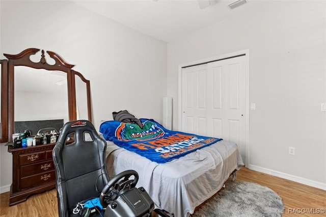 3563 W Blossom Dr, Beverly Hills, FL 34465 - bedroom featuring light wood-style flooring, a closet, baseboards, and ceiling fan