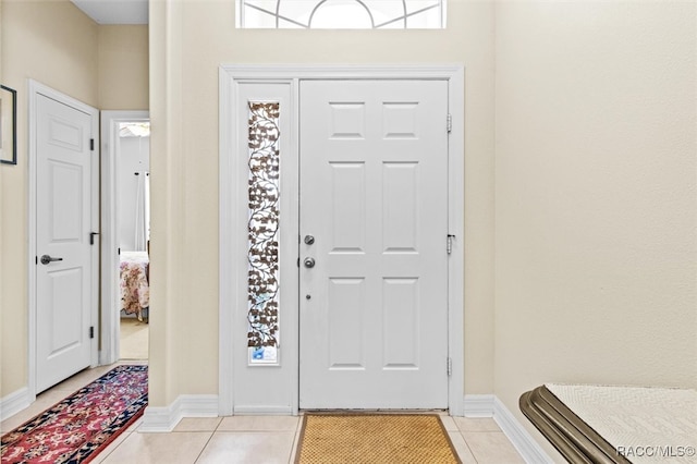 entryway featuring light tile patterned floors