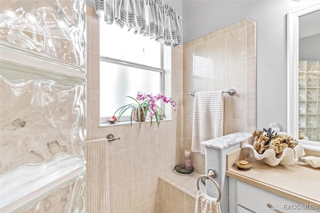 bathroom with a tile shower