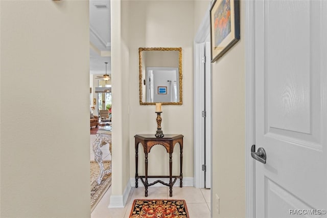 hall with light tile patterned floors