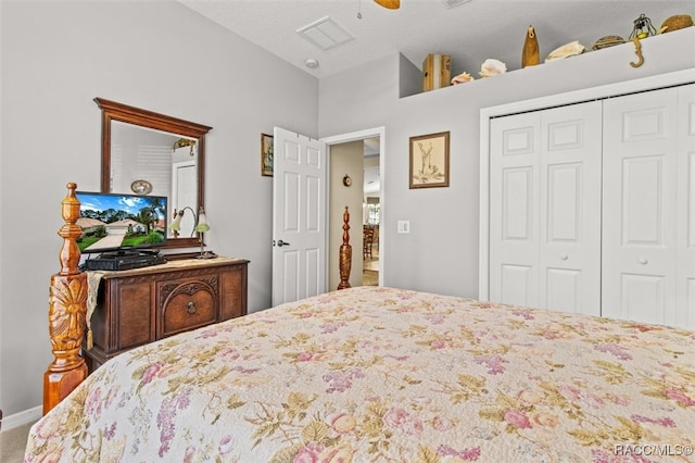 bedroom with ceiling fan and a closet