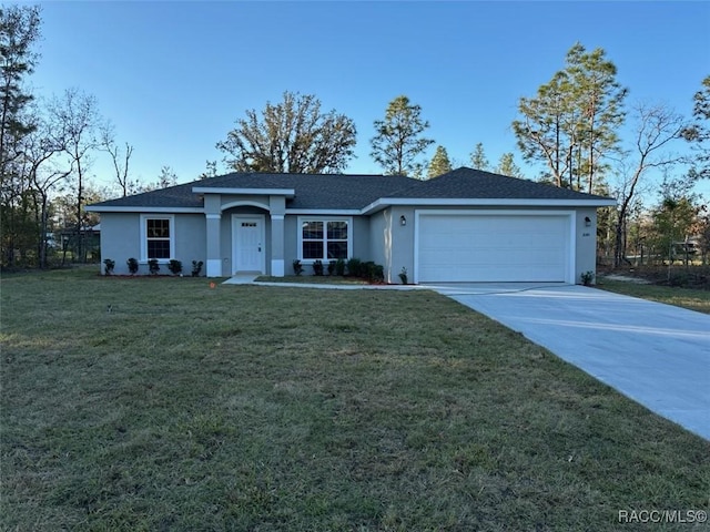 single story home with a garage, driveway, a front yard, and stucco siding