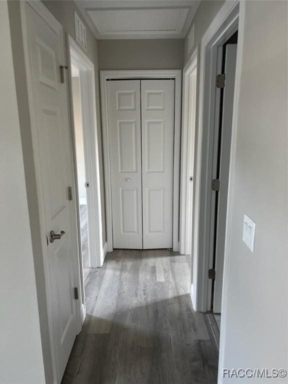 hall with visible vents and light wood-style flooring