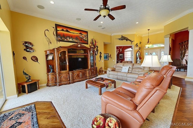 living room featuring crown molding, a textured ceiling, ceiling fan, and hardwood / wood-style flooring