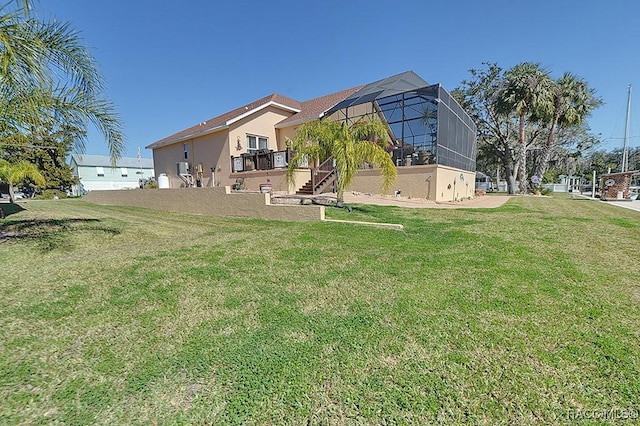 view of yard with a lanai