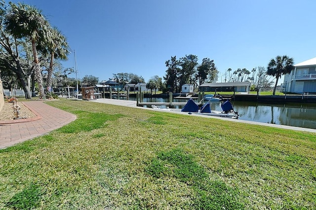 exterior space featuring a water view and a yard