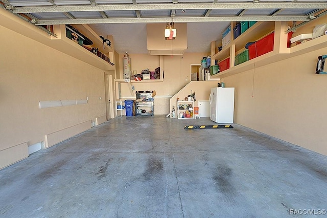 garage featuring a garage door opener and white fridge