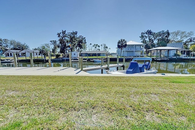 dock area featuring a yard and a water view