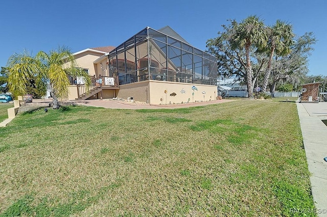 view of yard featuring glass enclosure