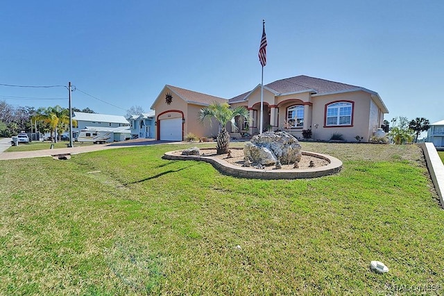 view of front of property with a garage and a front lawn