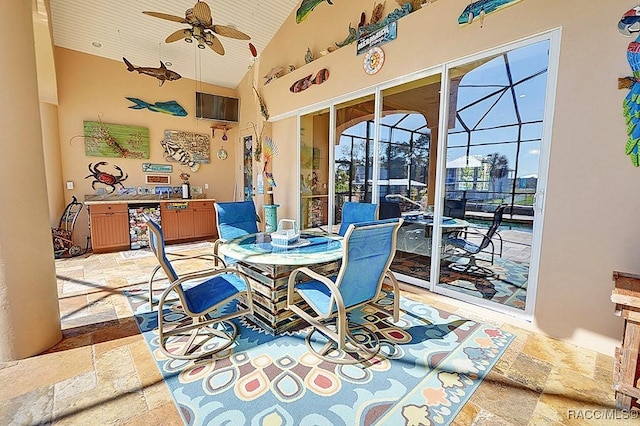 dining space featuring ceiling fan, high vaulted ceiling, and wooden ceiling