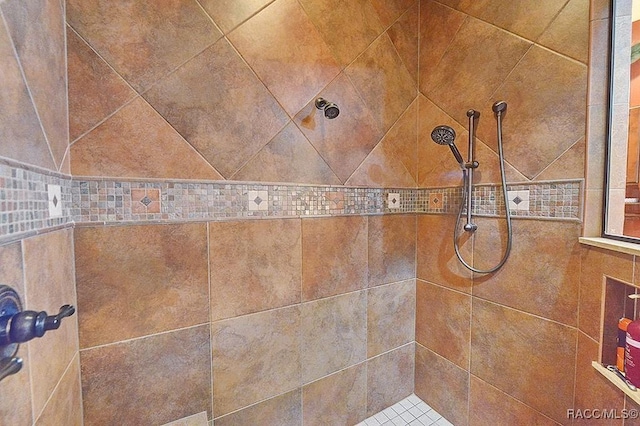 interior details with a tile shower