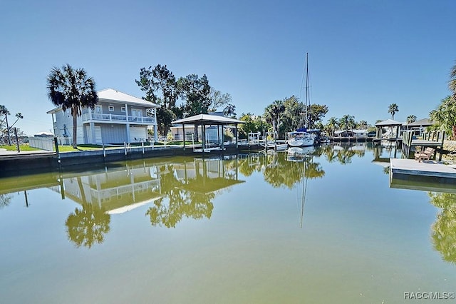 dock area with a gazebo and a water view