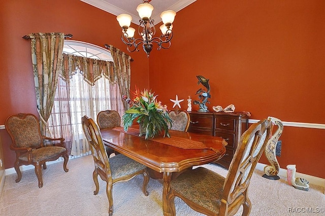 dining space featuring ornamental molding, light carpet, and an inviting chandelier