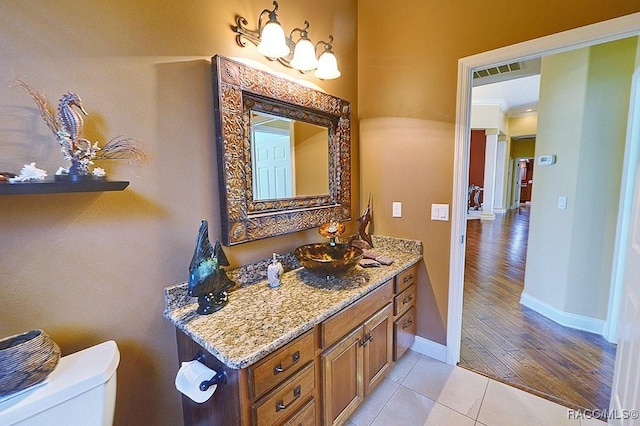 bathroom with vanity, tile patterned floors, and toilet