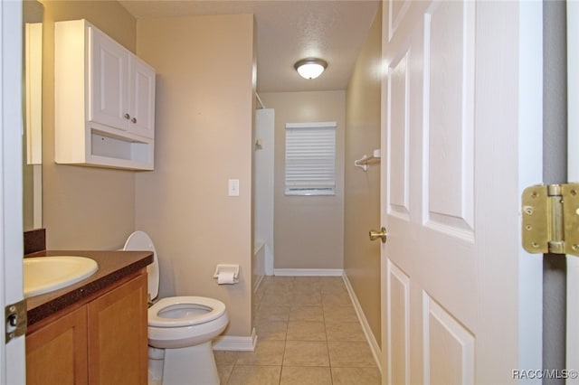 full bathroom featuring vanity, washtub / shower combination, tile patterned flooring, toilet, and a textured ceiling