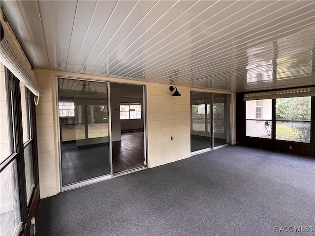 unfurnished sunroom featuring a wealth of natural light