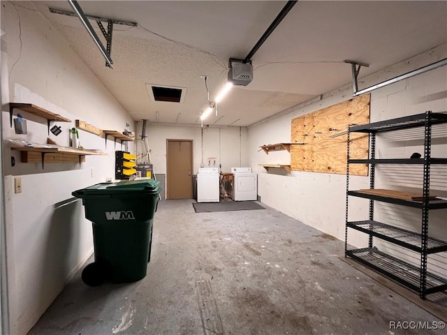 garage with washer and dryer and a garage door opener