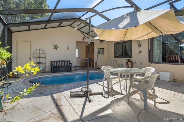 view of pool featuring a lanai and a patio