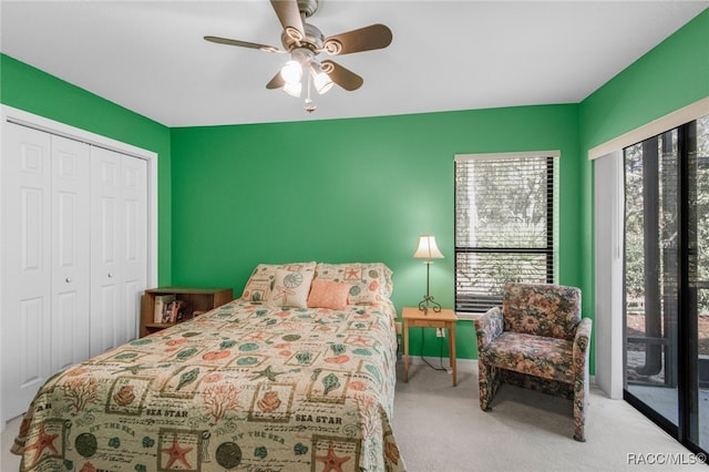 carpeted bedroom featuring access to exterior, a closet, and ceiling fan