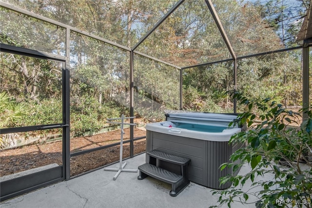 unfurnished sunroom with a jacuzzi