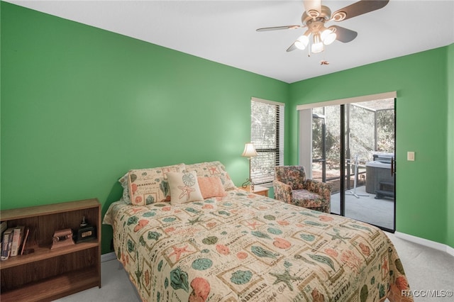 carpeted bedroom with ceiling fan and access to exterior