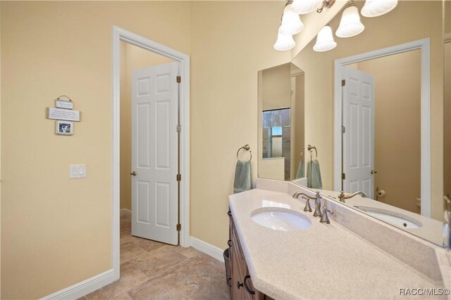 1626 N Eagle Ridge Path, Hernando, FL 34442 - bathroom featuring baseboards, vanity, and toilet