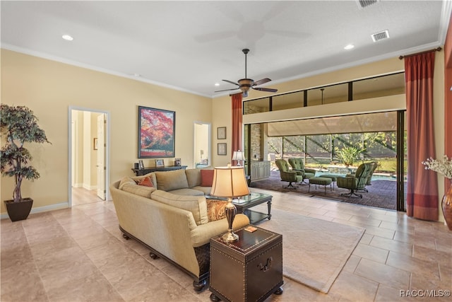 living room with ornamental molding and ceiling fan