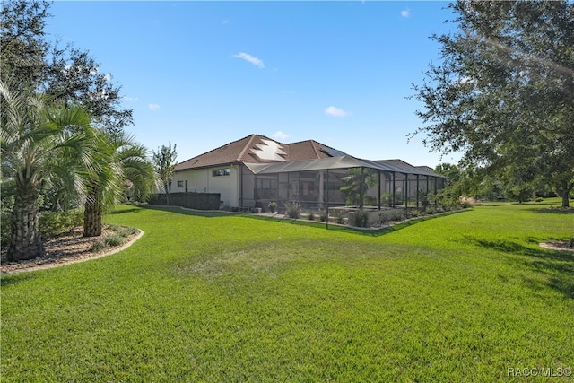 view of yard featuring glass enclosure