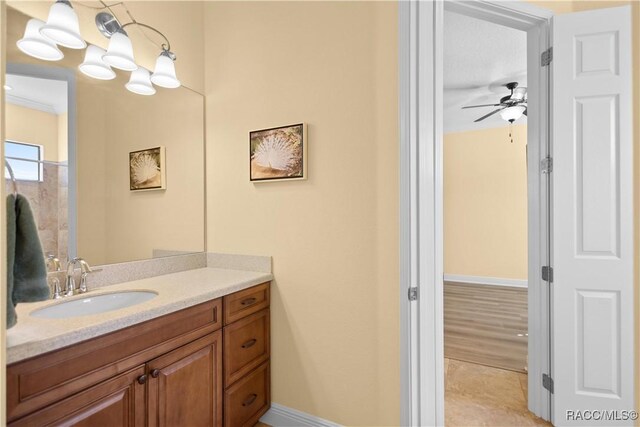 1626 N Eagle Ridge Path, Hernando, FL 34442 - bathroom featuring vanity, a ceiling fan, baseboards, and tile patterned floors