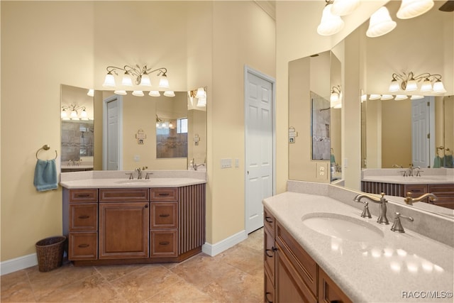 bathroom with vanity and a high ceiling