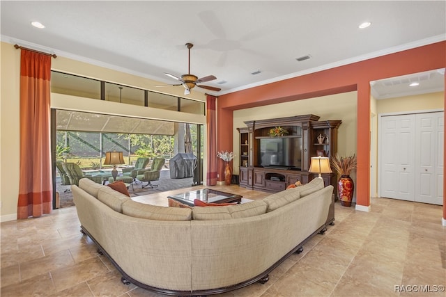 living room featuring crown molding and ceiling fan