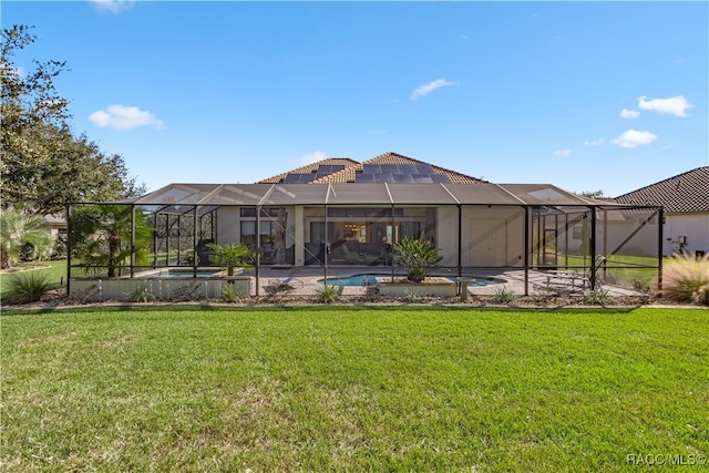 back of property featuring a yard, a lanai, and a patio