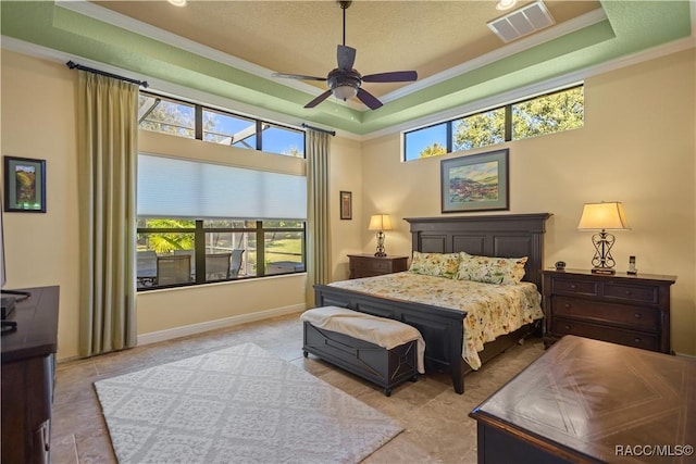 1626 N Eagle Ridge Path, Hernando, FL 34442 - bedroom featuring crown molding, a tray ceiling, and a ceiling fan
