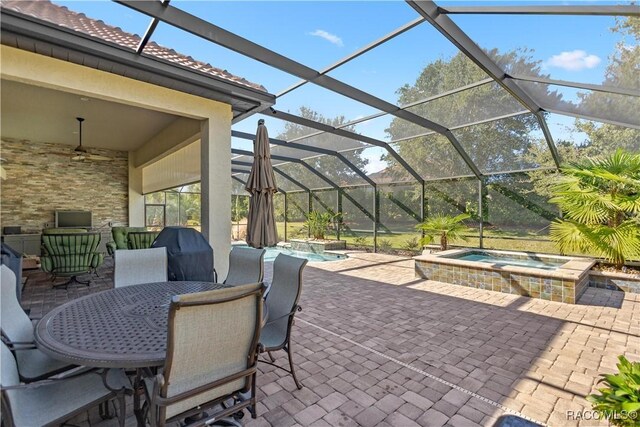 1626 N Eagle Ridge Path, Hernando, FL 34442 - view of patio / terrace with a ceiling fan, a pool with connected hot tub, a lanai, and outdoor dining area