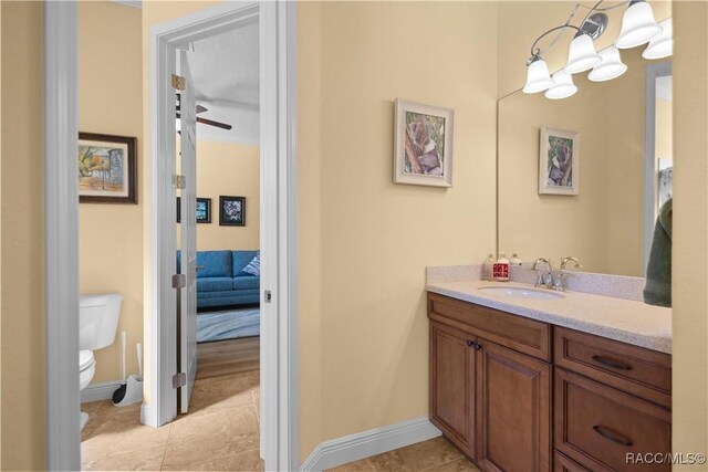 1626 N Eagle Ridge Path, Hernando, FL 34442 - bathroom featuring toilet, vanity, tile patterned floors, and baseboards