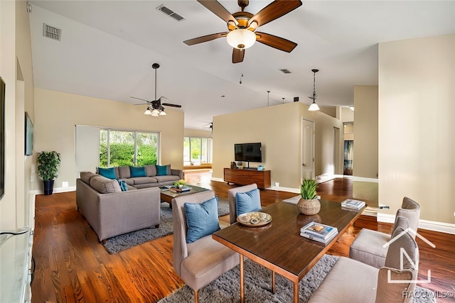 dining area with hardwood / wood-style flooring, ceiling fan, and lofted ceiling