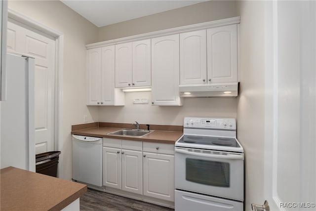 kitchen featuring dark hardwood / wood-style flooring, white cabinetry, sink, and white appliances