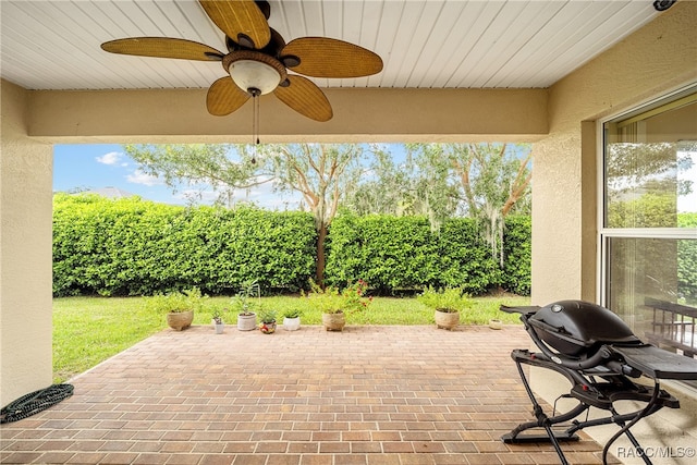 view of patio featuring ceiling fan