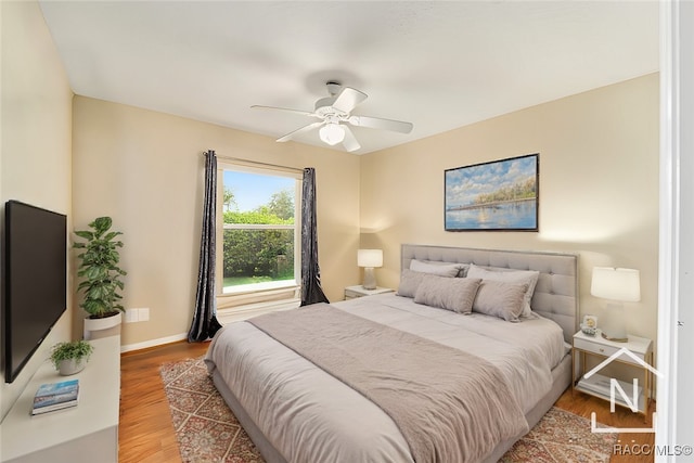 bedroom with wood-type flooring and ceiling fan